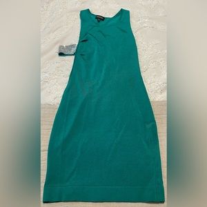 Green sexy bebe dress. Side cut out. Silver detail